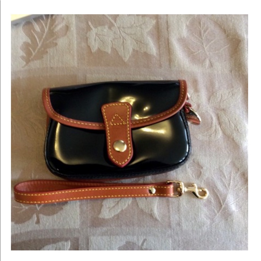 Dooney & Bourke Wristlet in black patent leather or FREE W/purchase of $100/up